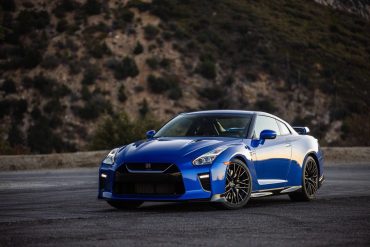 Blue Nissan GT-R R35 on road